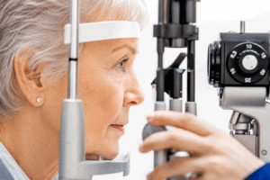 A senior woman receives an eye pressure test during a comprehensive eye exam.