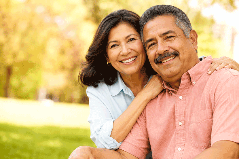 Aiello Eye Institute senior Hispanic couple learning about the early signs of cataracts and when to schedule an eye examination.